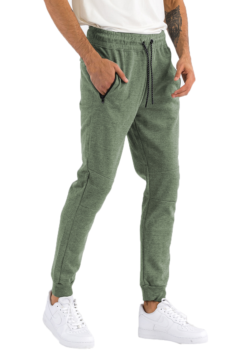 Heathered cotton sweats featuring an elastic waist, ankle cuffs, and a zipper pocket, displayed on a model.