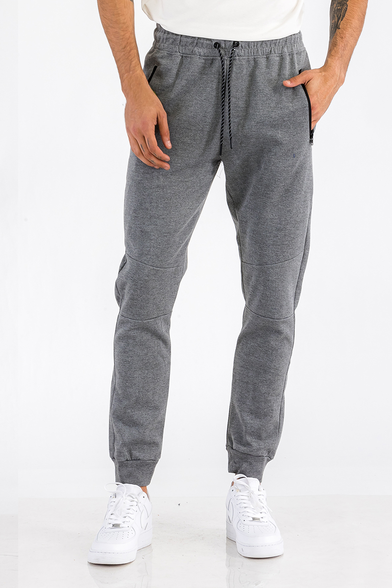 Heathered cotton sweats featuring elastic waist, ankle, and zipper pocket, perfect for casual wear.