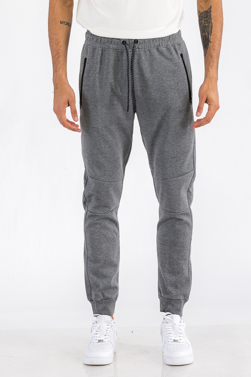 Heathered cotton sweats featuring elastic waist, ankle, and zipper pocket, perfect for casual wear.