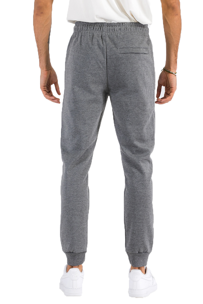 Heathered cotton sweats featuring elastic waist, ankle, and zipper pocket, perfect for casual wear.