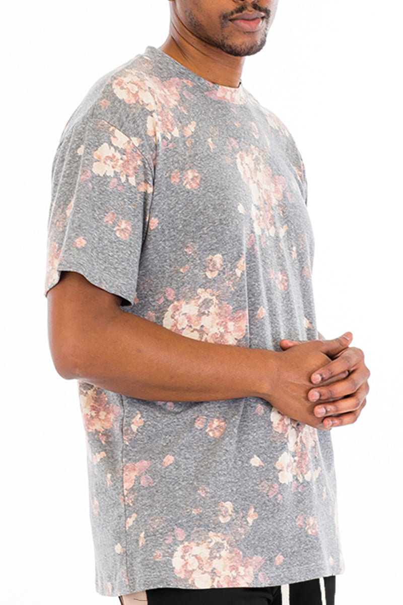 Heathered Floral Tee featuring a vibrant floral print, made from a soft polyester-spandex blend, displayed on a model.