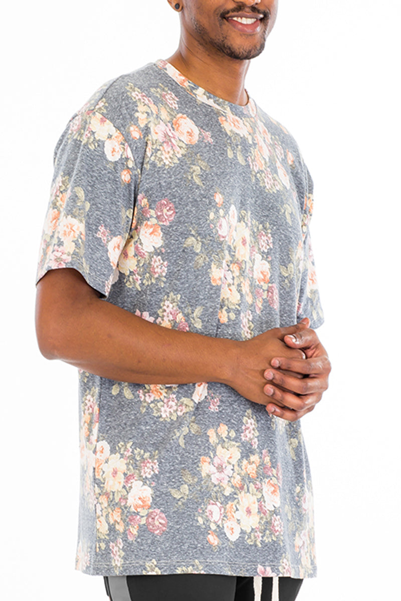 Heathered Floral Tee featuring a vibrant floral print, made from a soft polyester-spandex blend, displayed on a model.