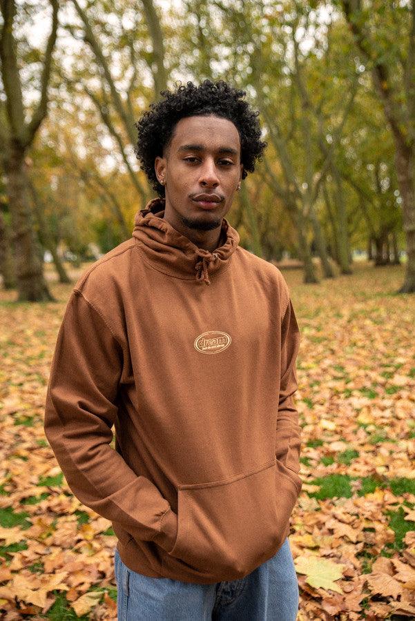 Caramel Toffee Hoodie featuring oval logo embroidery, showcasing its stylish design and heavyweight cotton material.