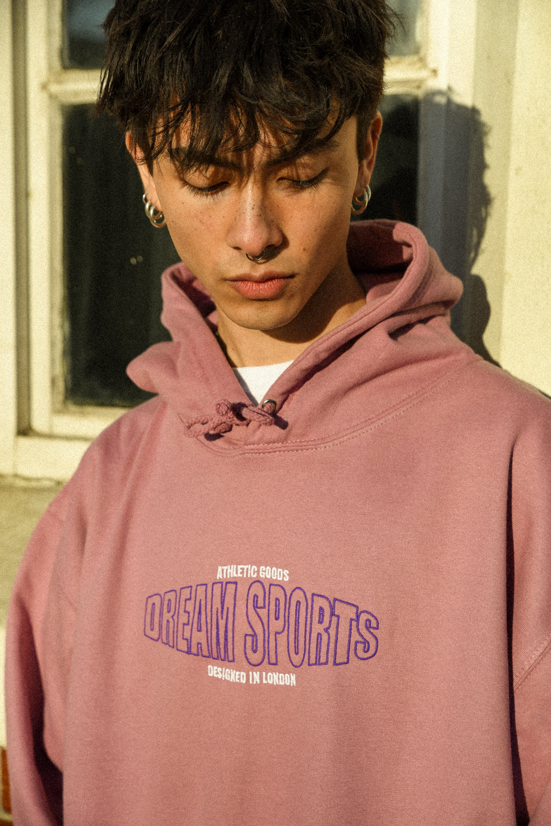 Dusty Purple unisex hoodie featuring Dream Sports embroidery, showcasing a relaxed fit and heavyweight cotton fabric.