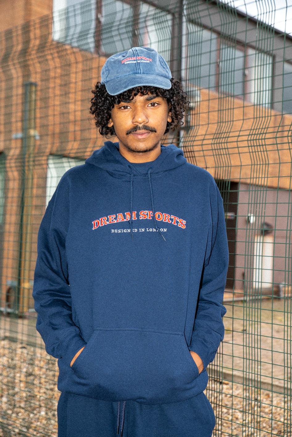 Navy hoodie featuring Dream Sports embroidery, showcasing a stylish design and heavyweight cotton material.