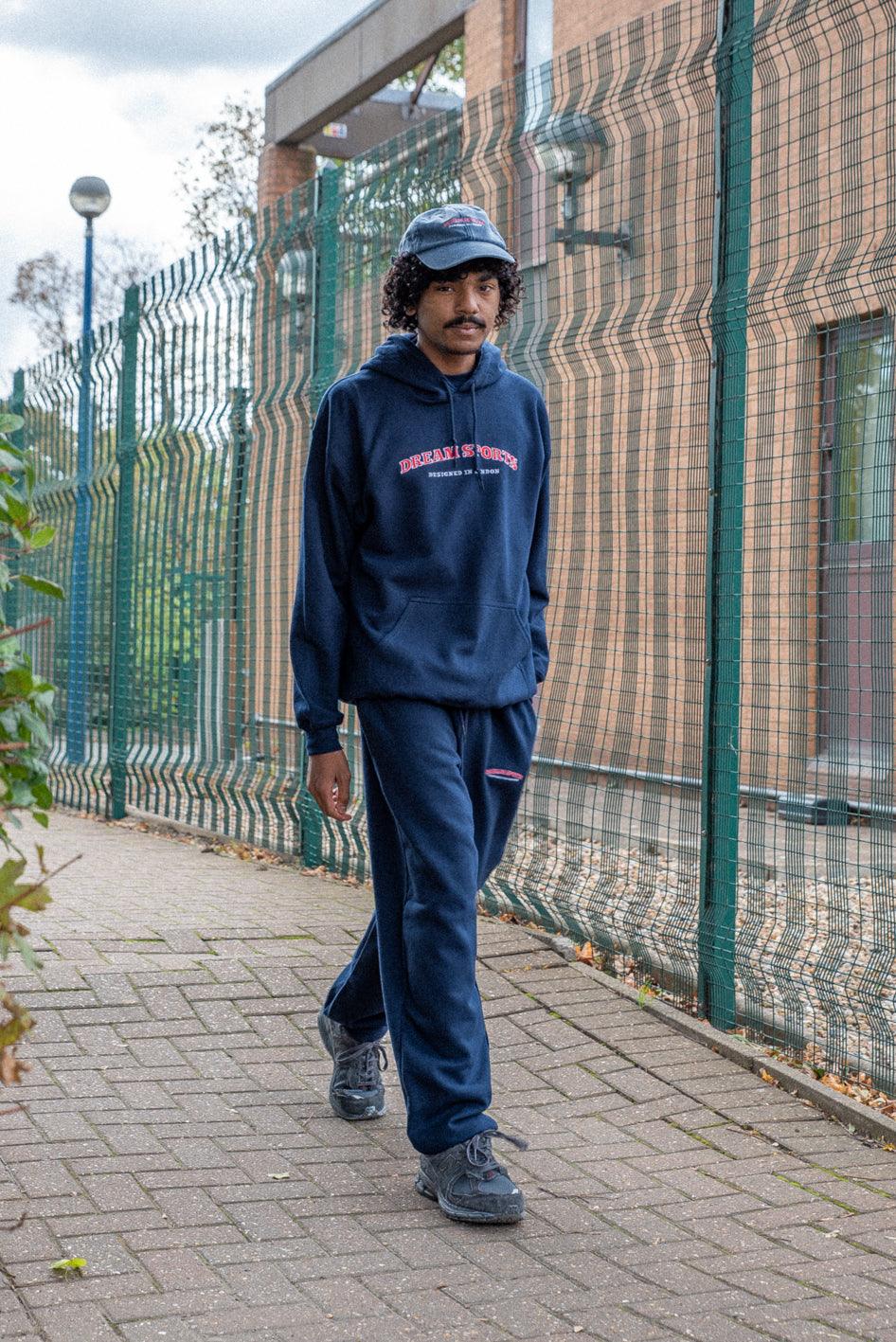 Navy hoodie featuring Dream Sports embroidery, showcasing a stylish design and heavyweight cotton material.