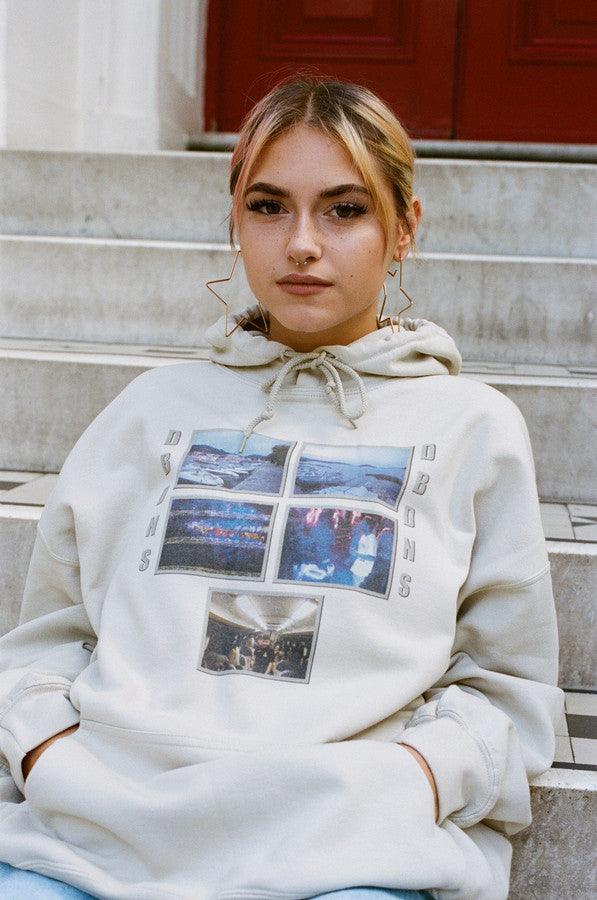 Sand unisex hoodie featuring a vibrant Croatian festival photo print, showcasing a relaxed fit and stylish design.