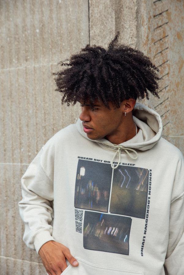 A stylish sand-colored hoodie featuring a ghost town print, perfect for summer wear.