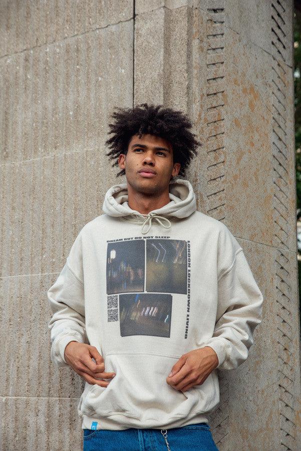 A stylish sand-colored hoodie featuring a ghost town print, perfect for summer wear.