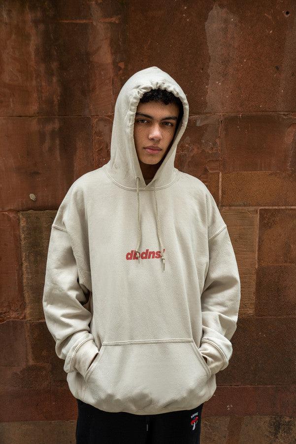 Sand hoodie featuring Go Raving! print on the front and graphic design on the back, showcasing relaxed fit and stylish details.