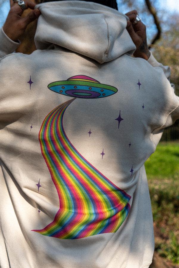 A stylish sand-colored hoodie featuring a vibrant trippy alien invasion print, perfect for casual wear and showcasing unique style.