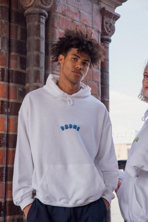 White hoodie featuring a blueberry bubble logo print, showcasing a relaxed fit and woven label details.