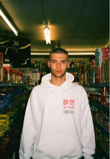 White hoodie featuring a bold Chinese dragon print on the back and brand name in traditional Chinese lettering on the front left chest.