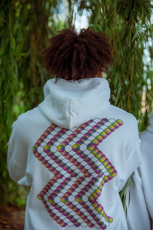 White hoodie featuring a colorful Zig-Zag geometric logo print on the back, showcasing vibrant wavy graphics.