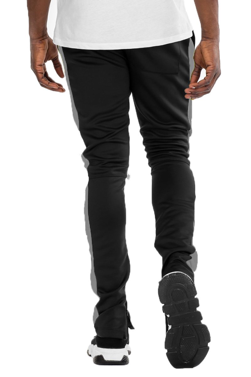 Holiday Track Pants in Black and Grey with a skinny fit, featuring standard pockets and a hidden ankle zipper.