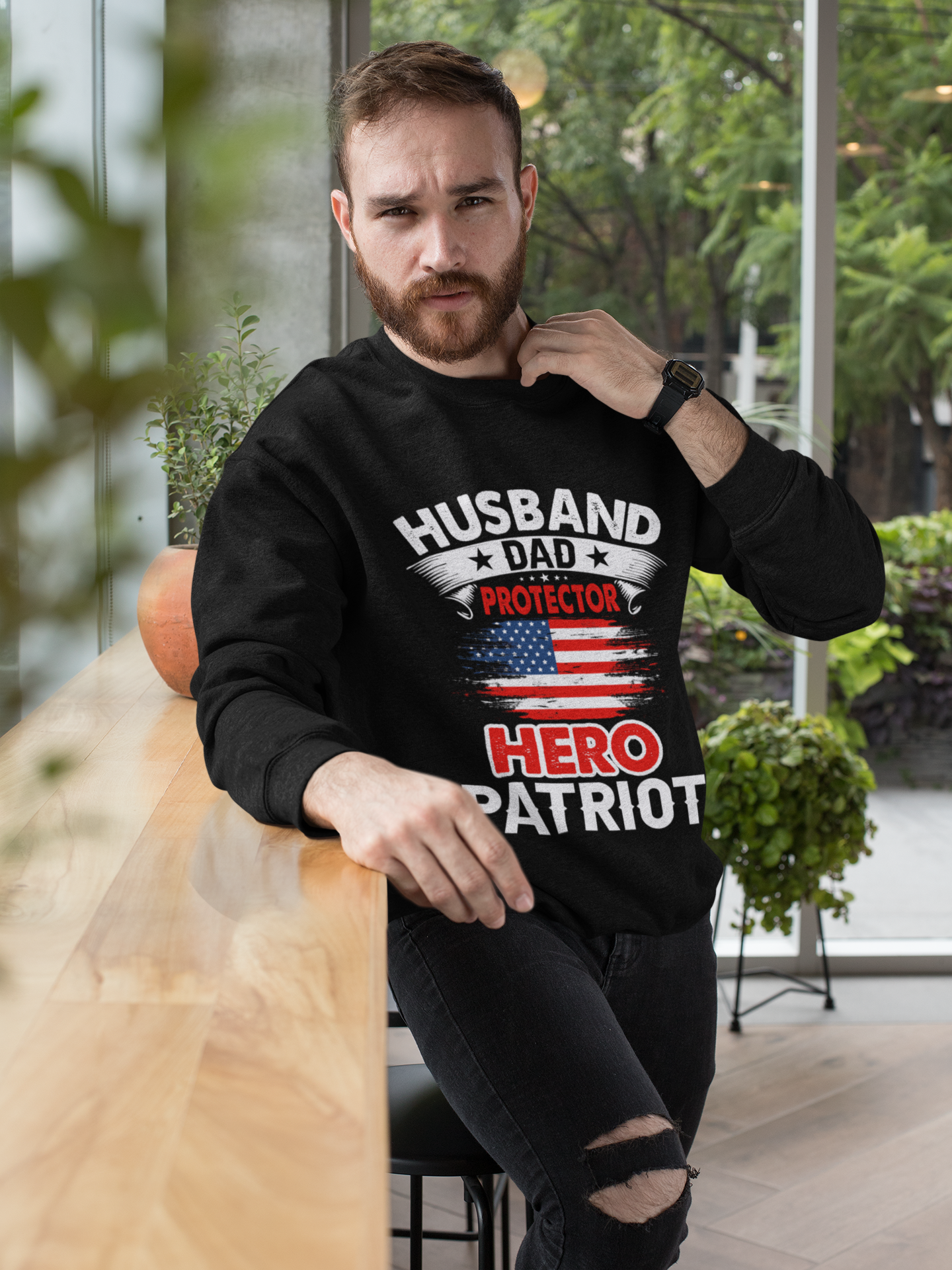 Husband, Dad, Protector, Hero, Patriot Crewneck Sweatshirt displayed on a hanger, showcasing its soft fabric and trendy design.