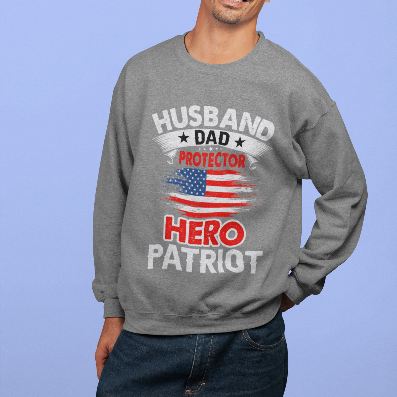 Husband, Dad, Protector, Hero, Patriot Crewneck Sweatshirt displayed on a hanger, showcasing its soft fabric and trendy design.