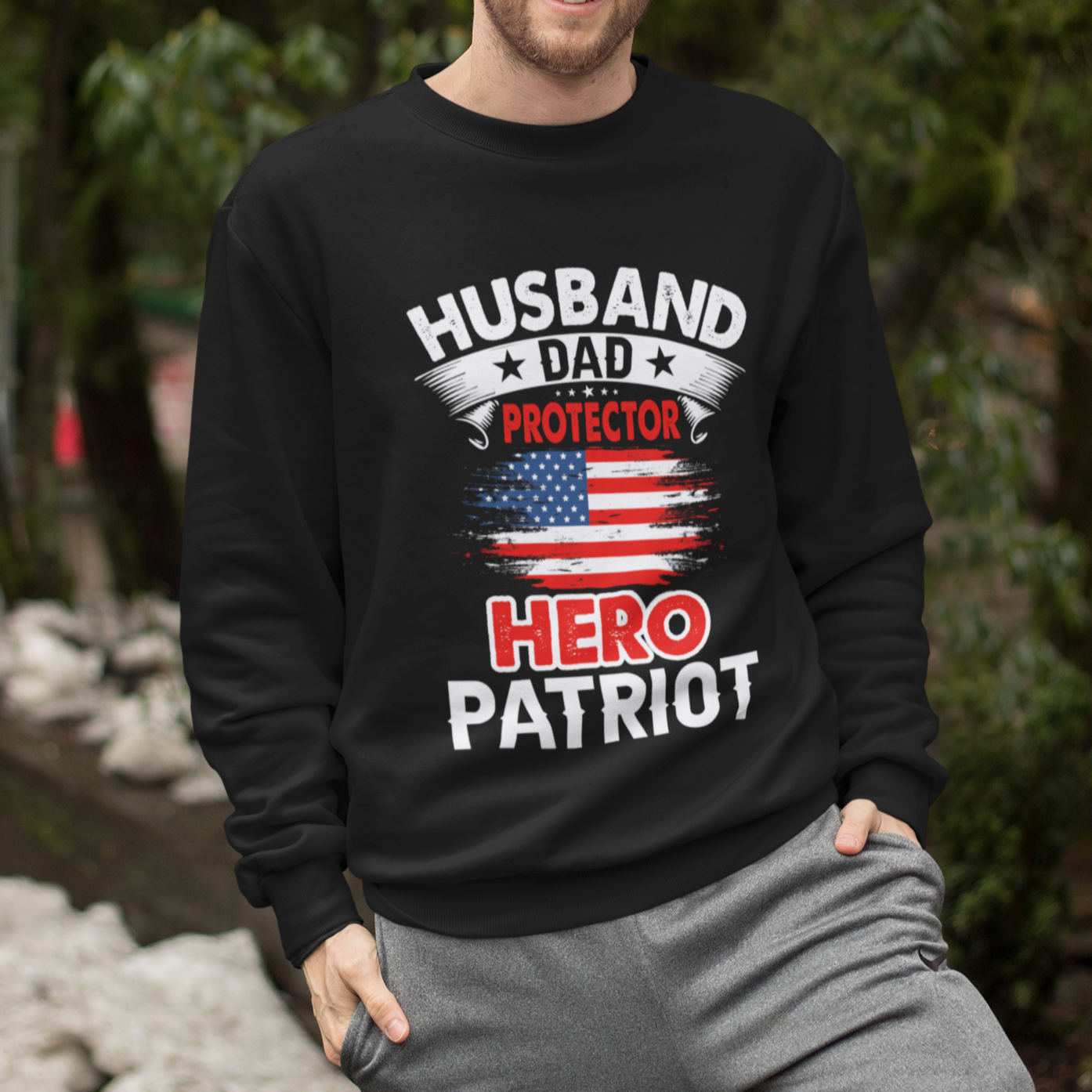 Husband, Dad, Protector, Hero, Patriot Crewneck Sweatshirt displayed on a hanger, showcasing its soft fabric and trendy design.