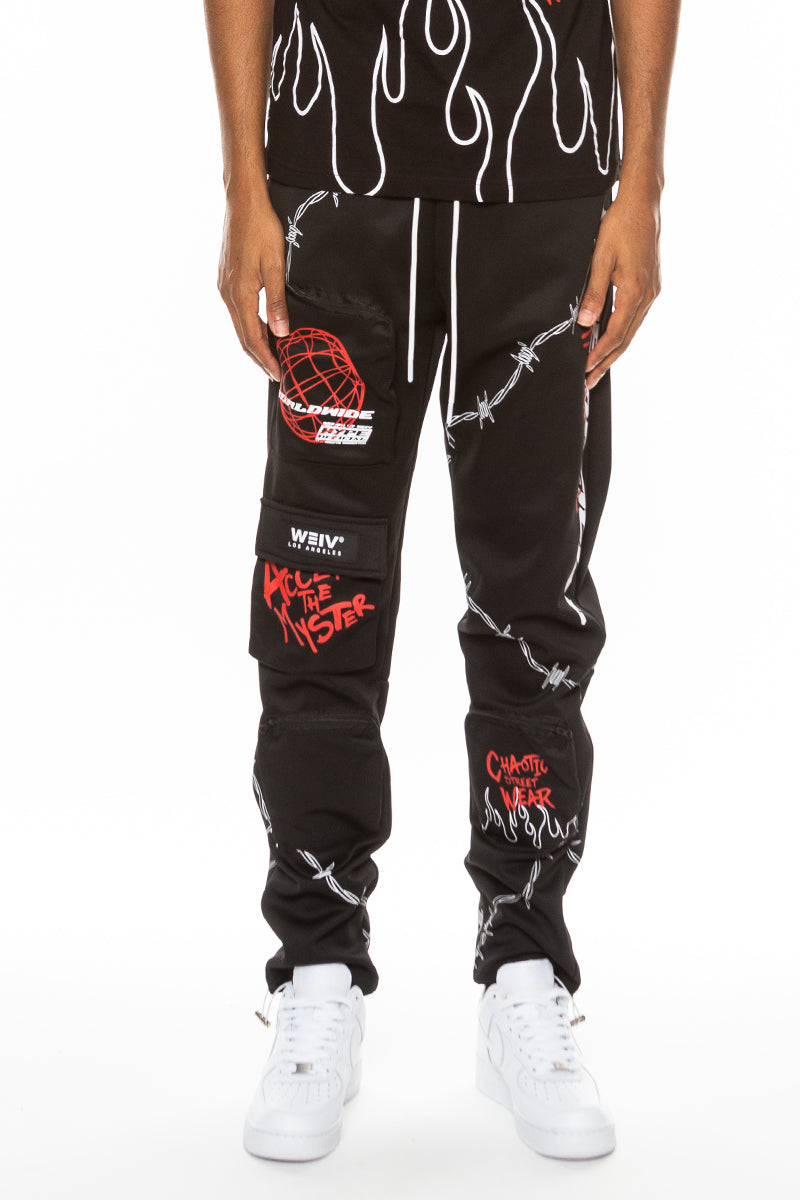 Hype Official Print Track Pants featuring a vibrant digital print, elastic waist, and zippered pockets, perfect for casual and athletic wear.