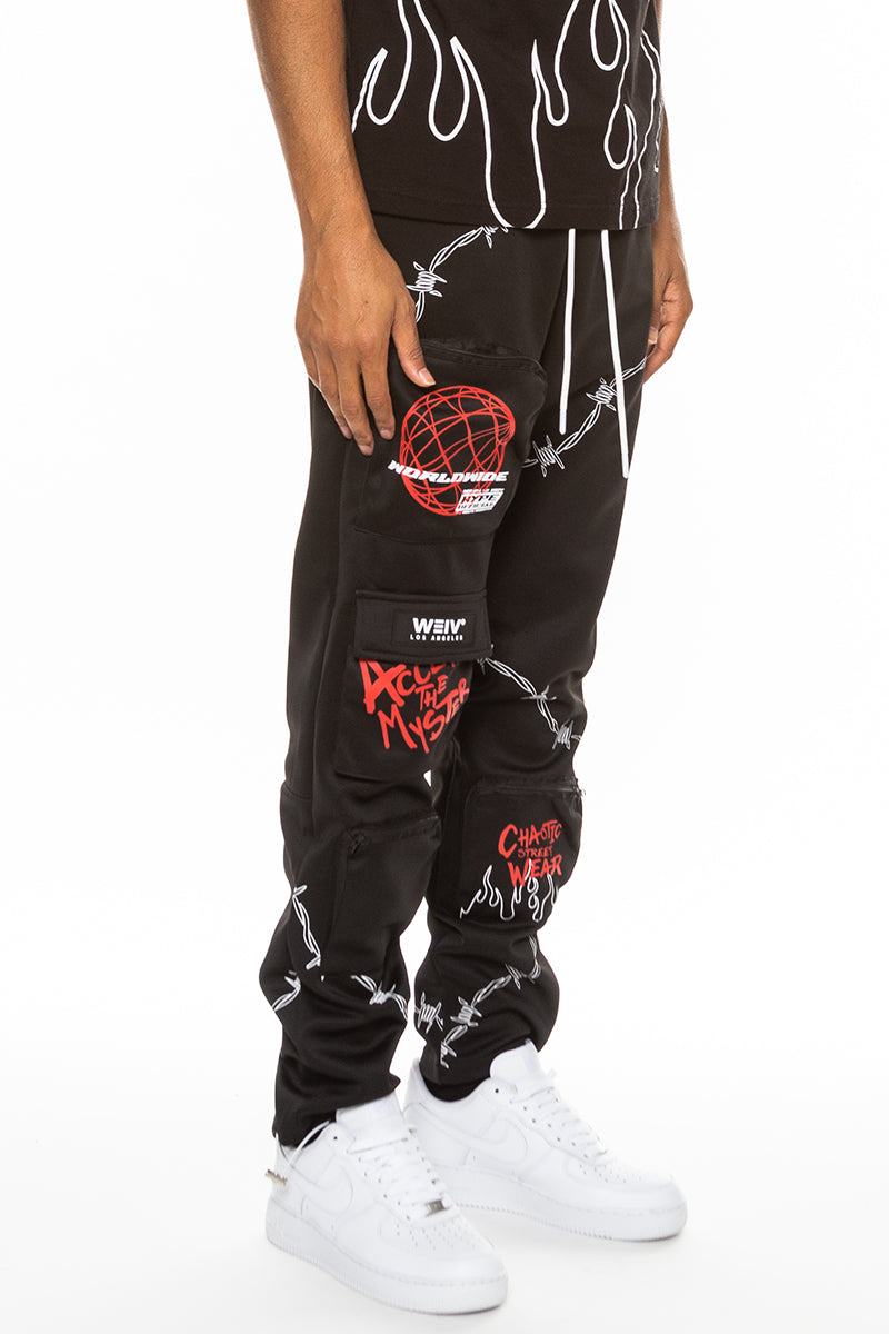 Hype Official Print Track Pants featuring a vibrant digital print, elastic waist, and zippered pockets, perfect for casual and athletic wear.