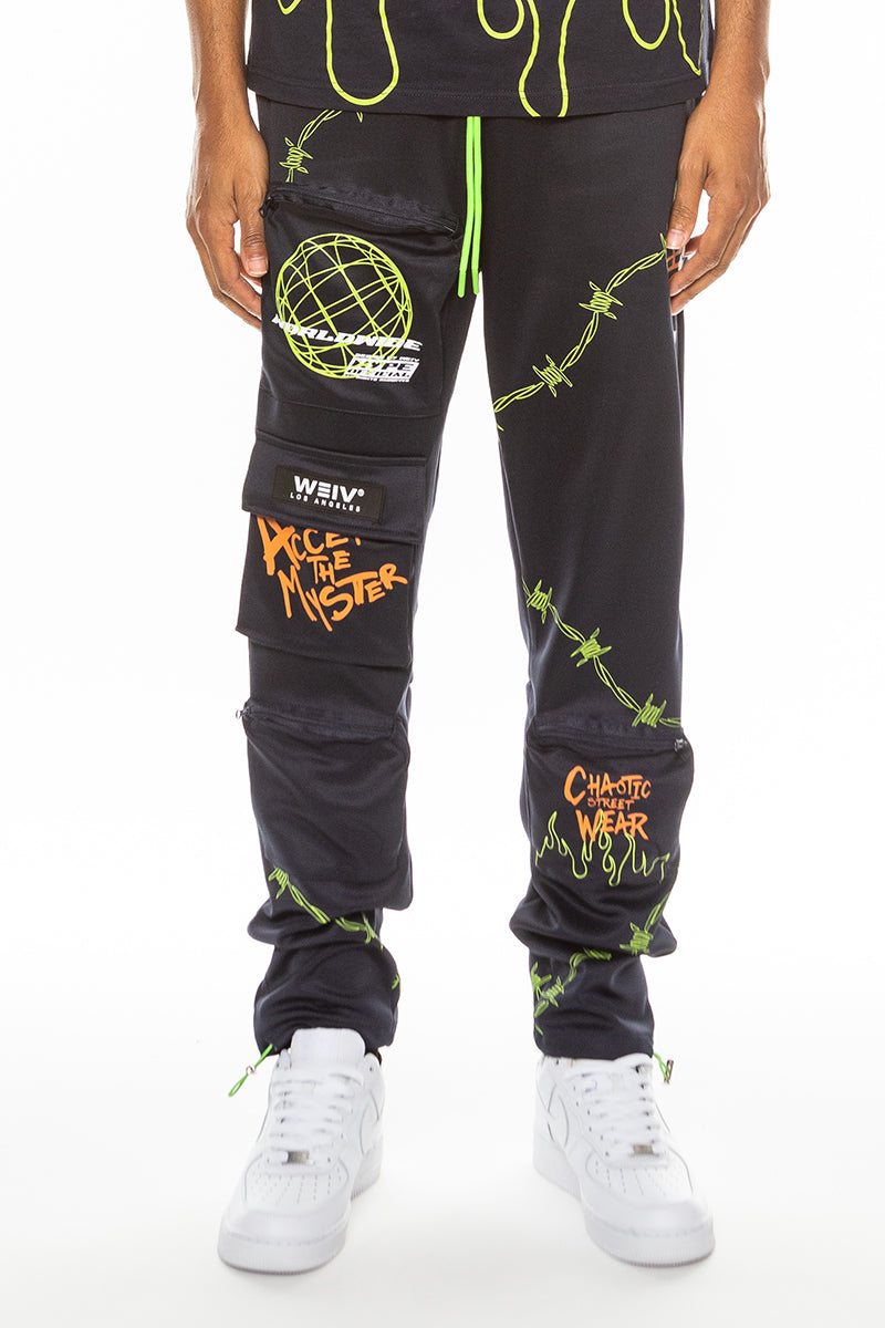 Hype Official Print Track Pants featuring a vibrant digital print, elastic waist, and zippered pockets, perfect for casual and athletic wear.