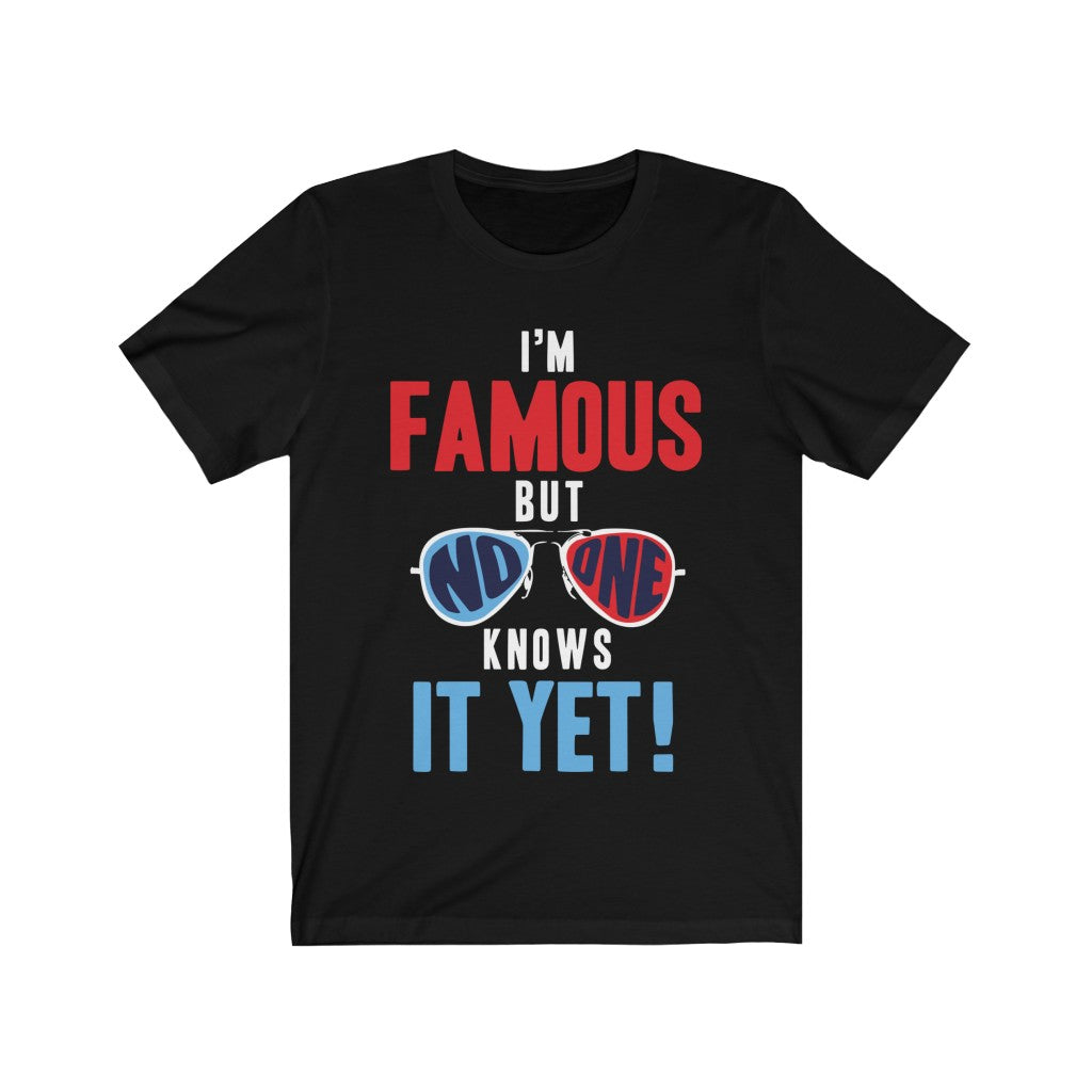 A soft cotton unisex t-shirt featuring the slogan 'I am Famous But No One Knows it Yet' printed in vibrant vinyl, perfect for casual wear.