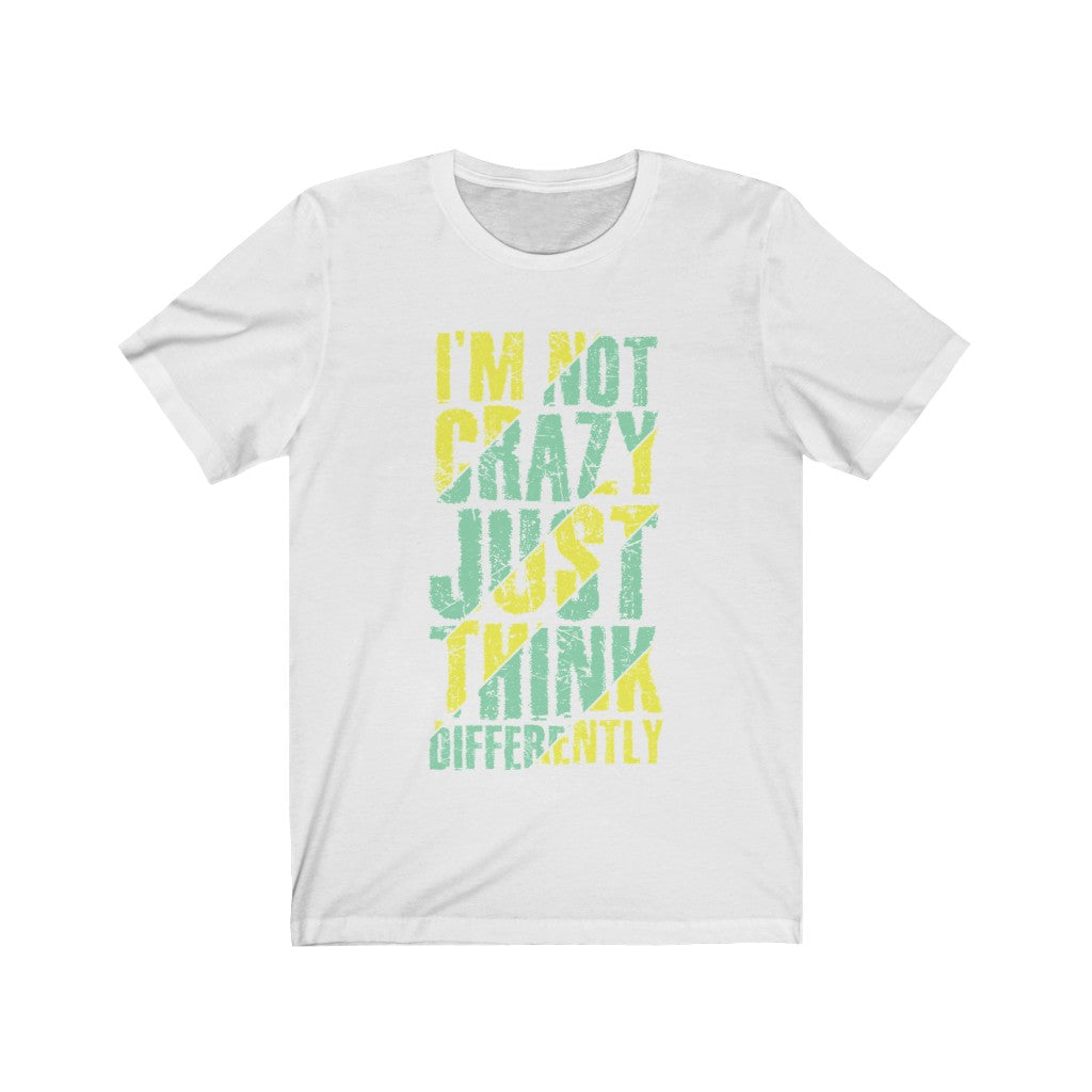 A unisex t-shirt featuring the phrase 'I am not Crazy Just Think Differently' in bold vinyl print, made from 100% soft cotton.