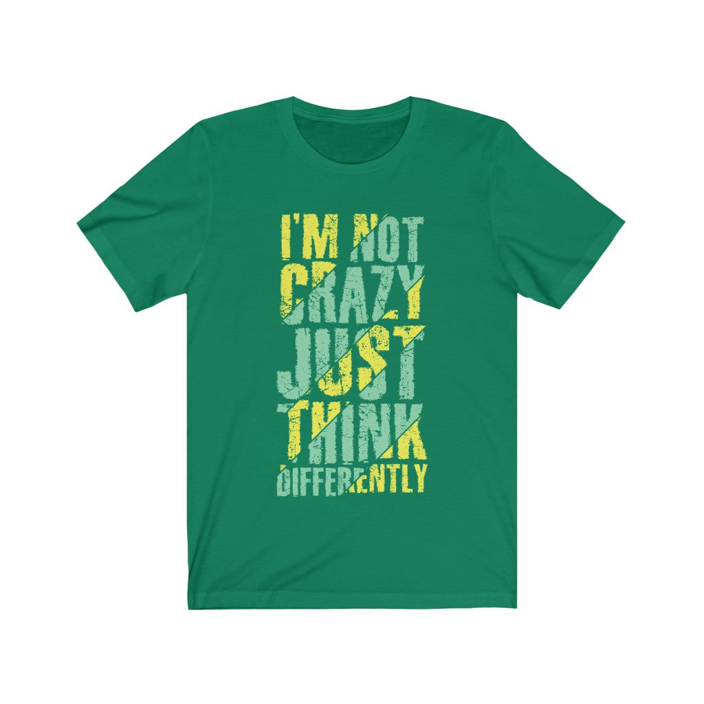 A unisex t-shirt featuring the phrase 'I am not Crazy Just Think Differently' in bold vinyl print, made from 100% soft cotton.