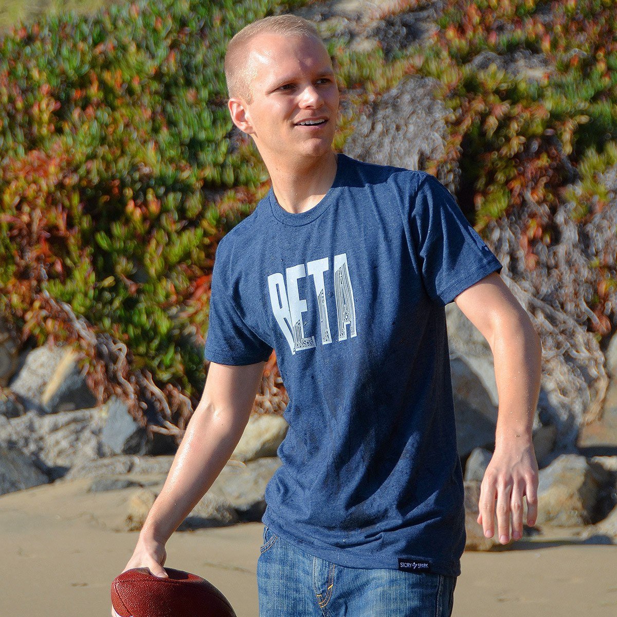 In Beta T-Shirt in dark heather navy featuring a launch rocket sleeve print, made from soft ring-spun cotton.