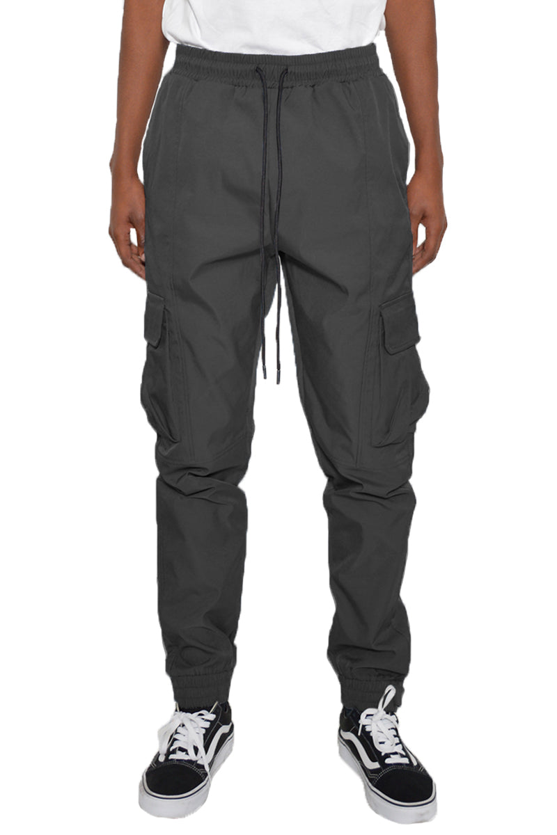 Iridescent Cargo Jogger showcasing shimmering fabric, elastic waist, and cargo pockets.