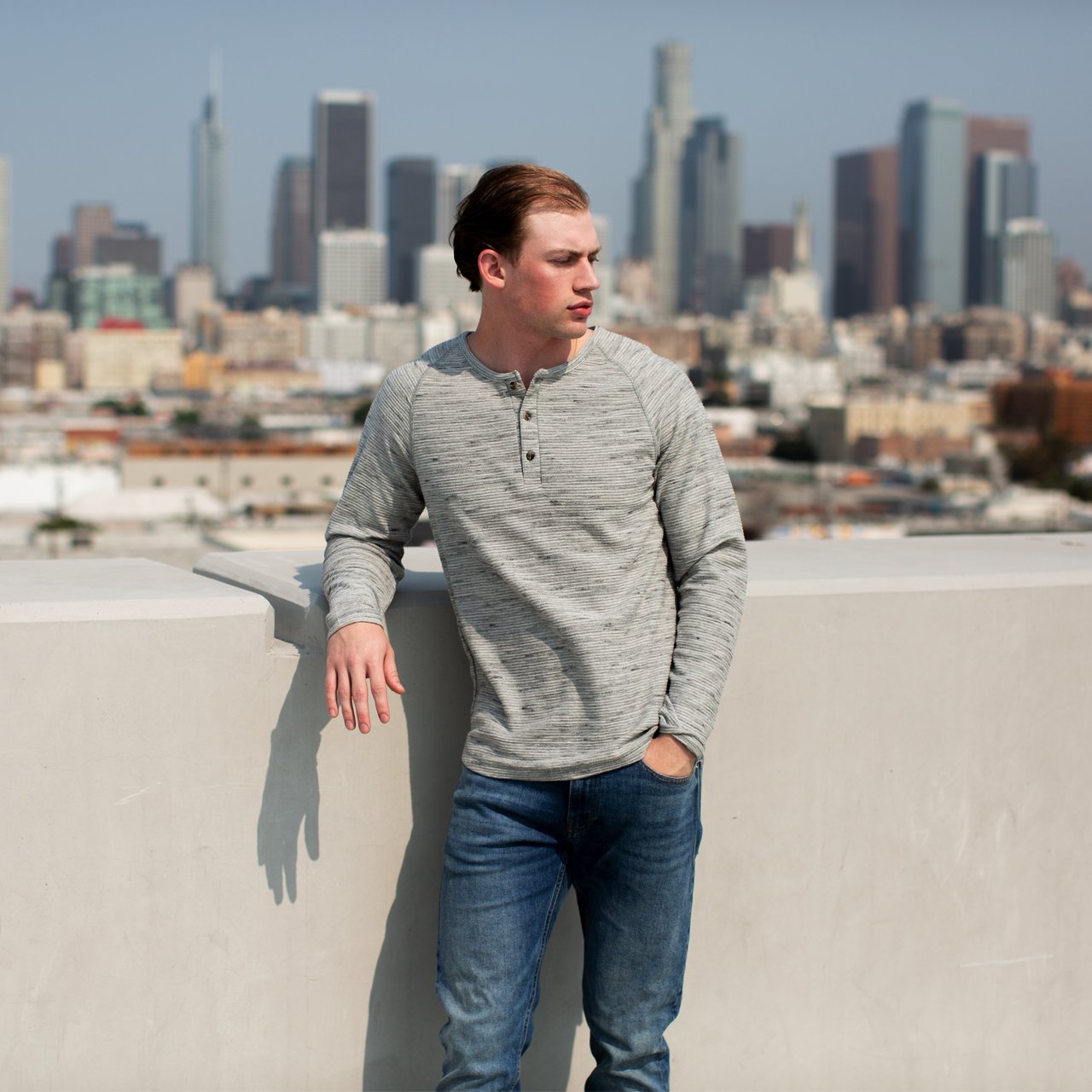 Jax Long Sleeve Henley in Grey Heather with raglan sleeves and 3-button placket, made from eco-friendly materials.