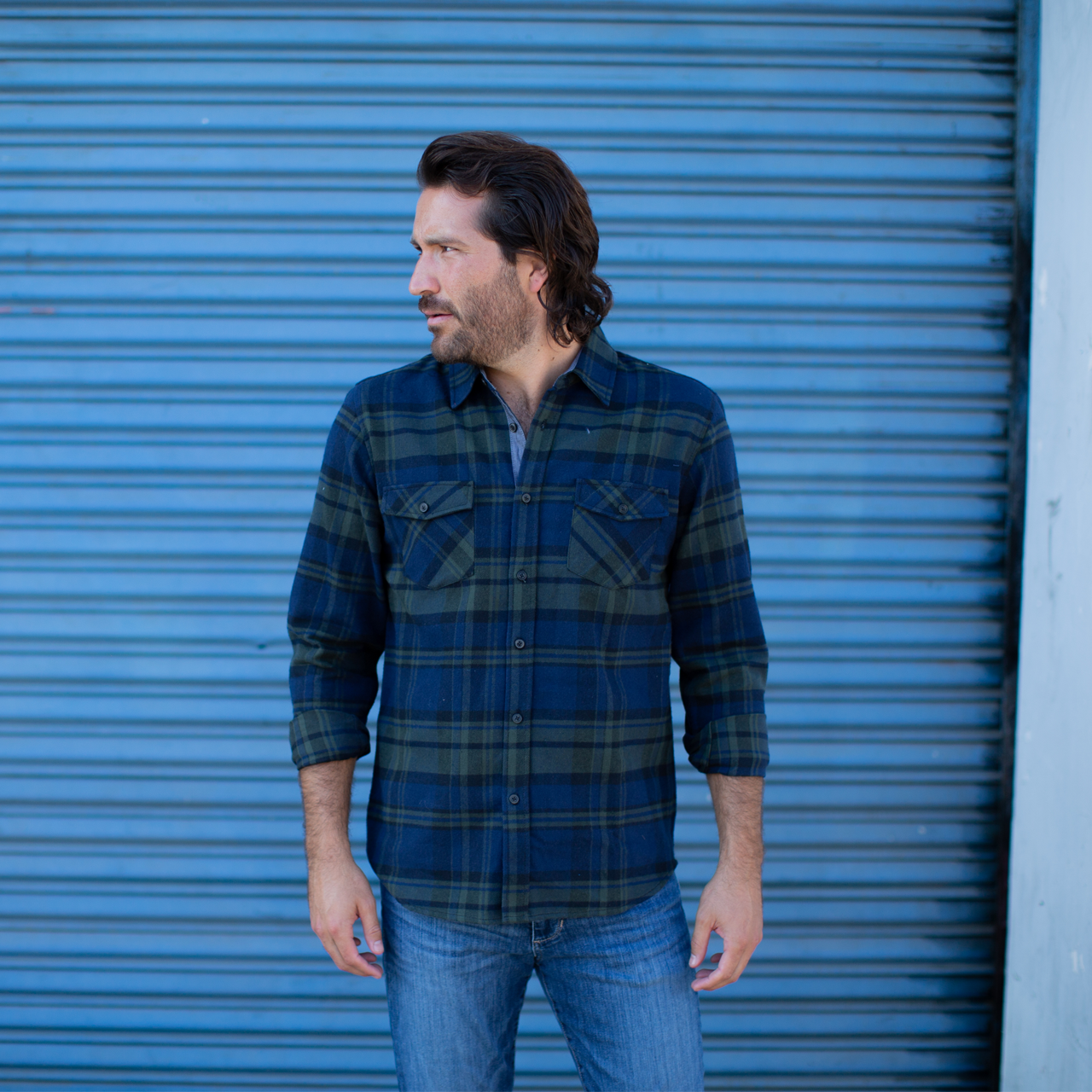 Jaylen Flannel Shirt in green plaid with long sleeves and two patch pockets.