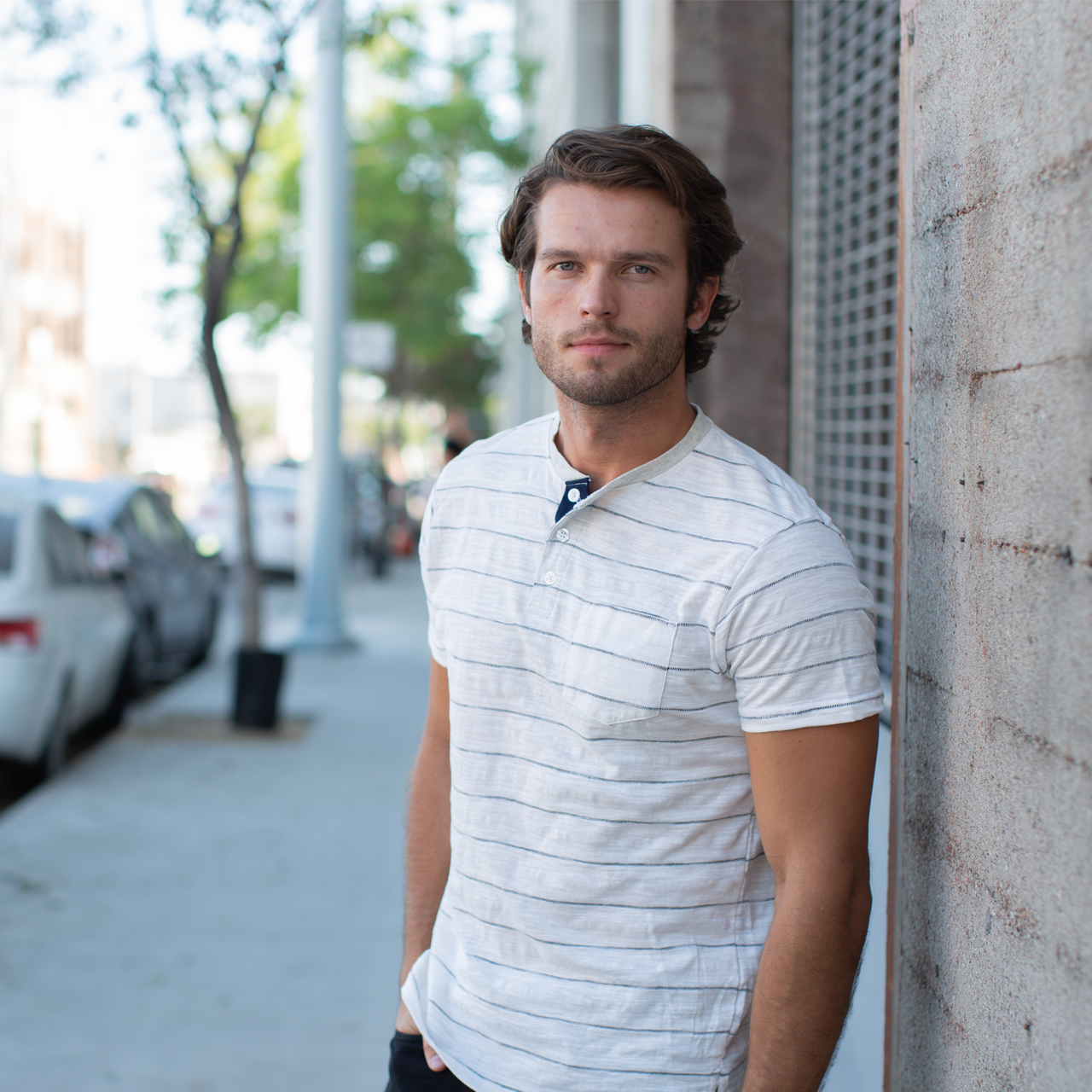 Josiah Jacquard Striped Henley featuring a cream color, jacquard stripes, and a stylish patch pocket.