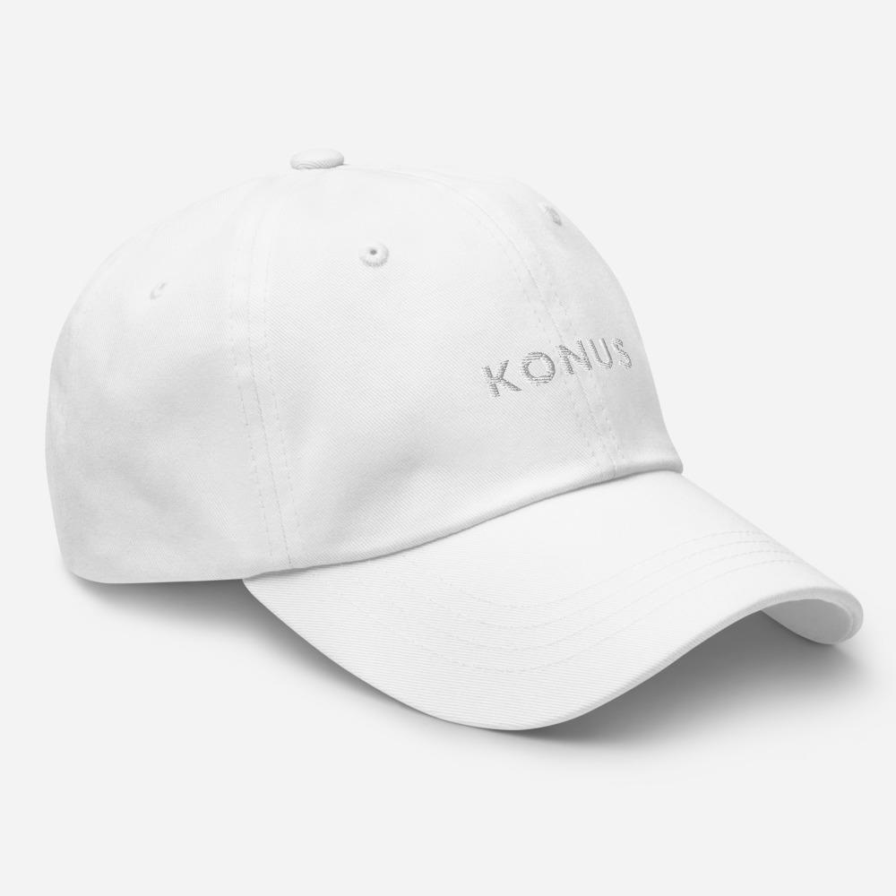 A stylish Konus Dad Hat featuring a low profile, adjustable strap, and curved visor, made from 100% chino cotton twill.