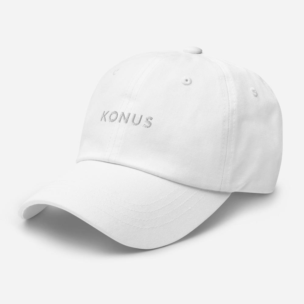 A stylish Konus Dad Hat featuring a low profile, adjustable strap, and curved visor, made from 100% chino cotton twill.