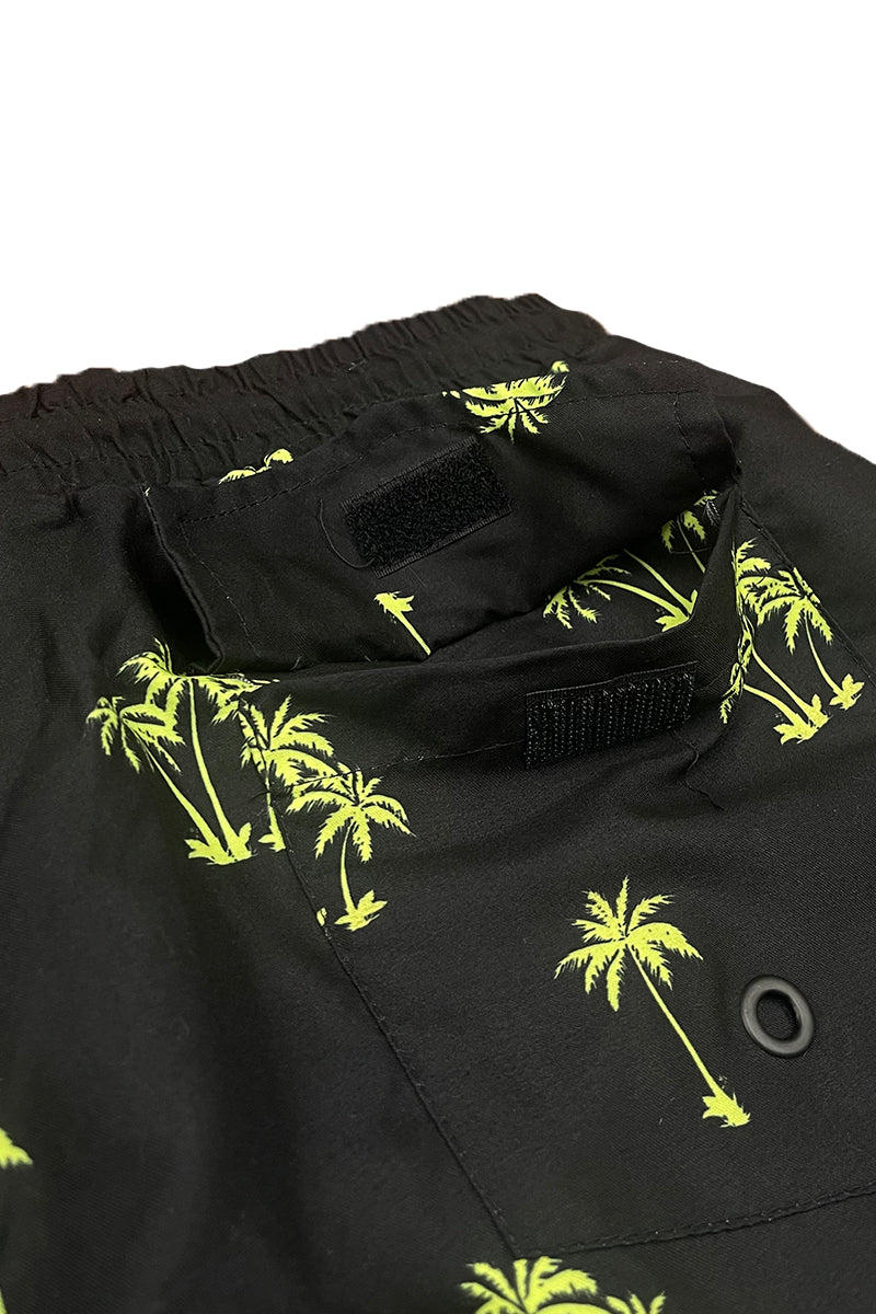 Lime palm print swim shorts featuring a vibrant tropical design, mesh lining, and pockets for convenience.