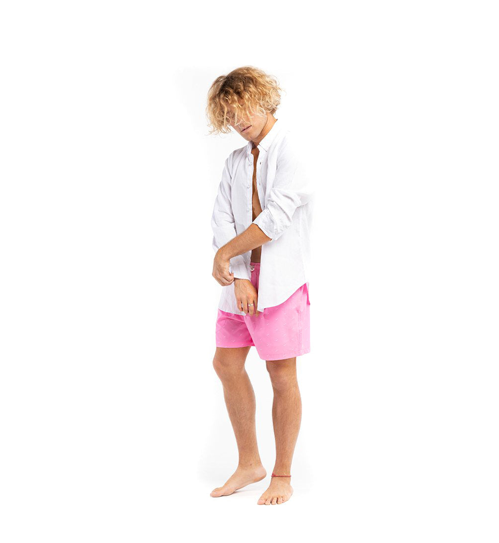 A stylish white linen shirt with a button-down collar, perfect for summer wear, displayed on a wooden hanger against a light background.