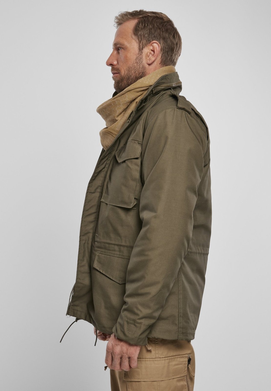 M65 Classic Jacket featuring a robust, water-repellent design with a removable inner jacket and hood in collar, perfect for urban adventures.