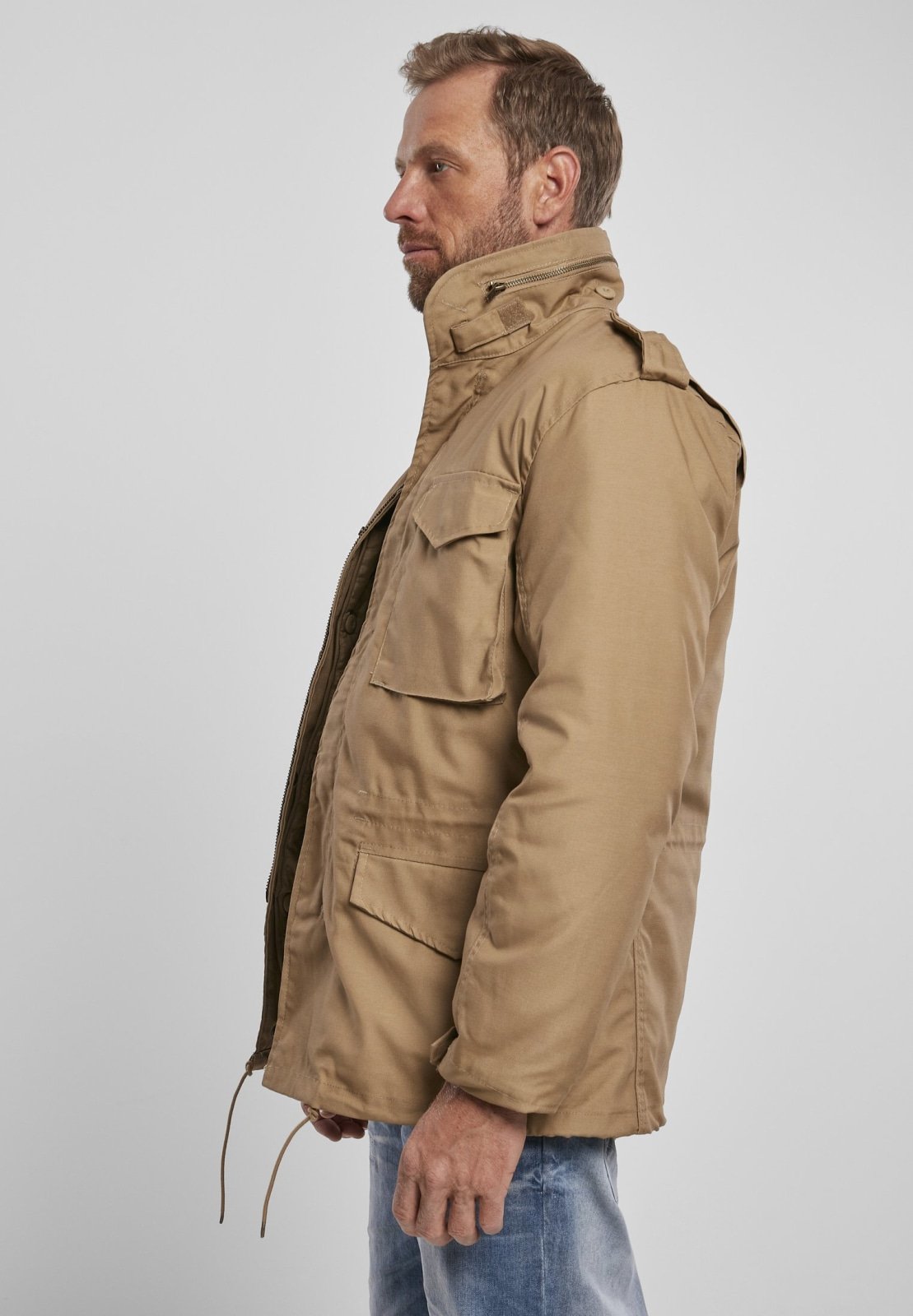 M65 Classic Jacket featuring a robust, water-repellent design with a removable inner jacket and hood in collar, perfect for urban adventures.