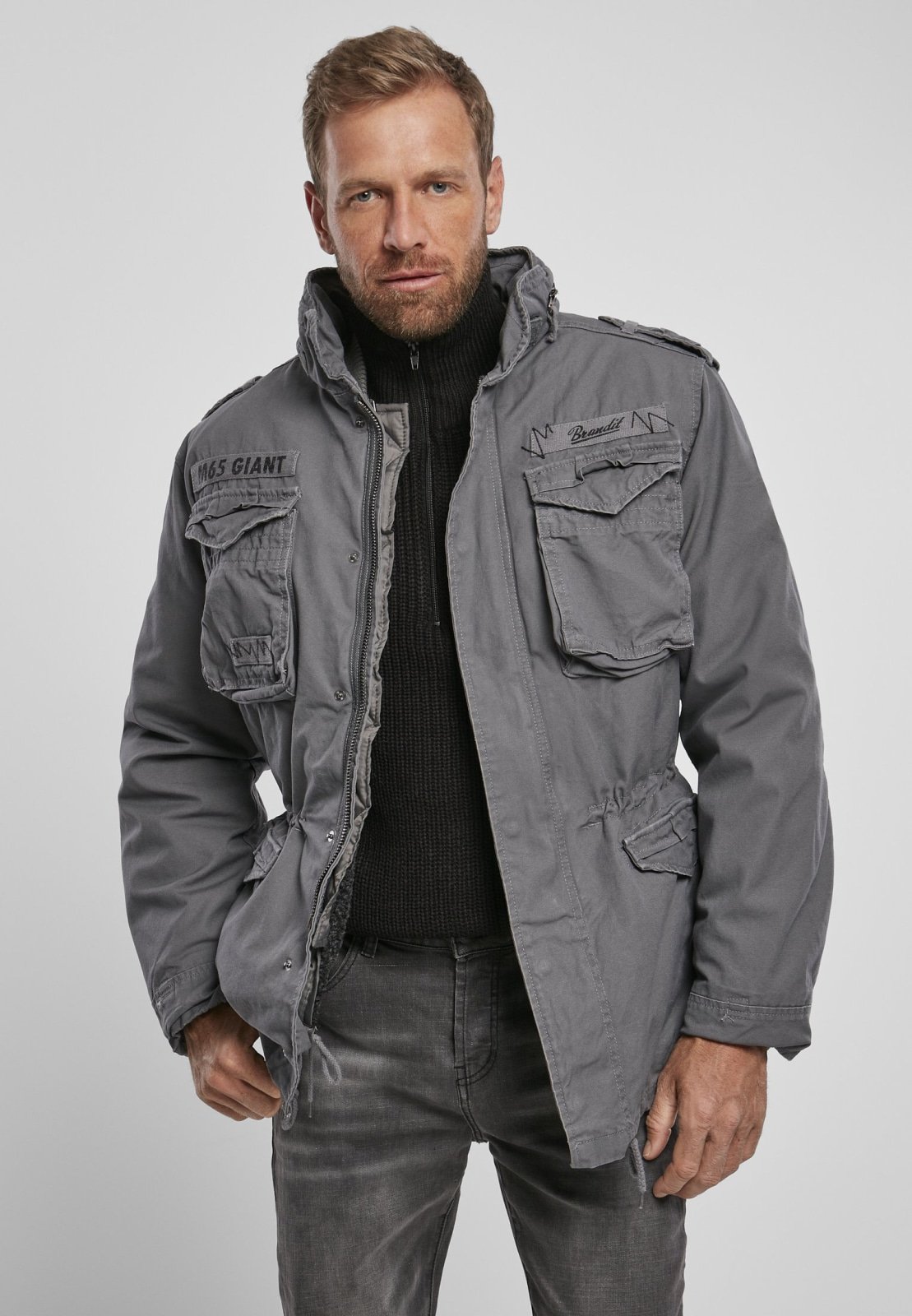 M65 Giant Jacket featuring a heavy cotton outer layer, removable inner jacket, and adjustable waist for a stylish and versatile look.