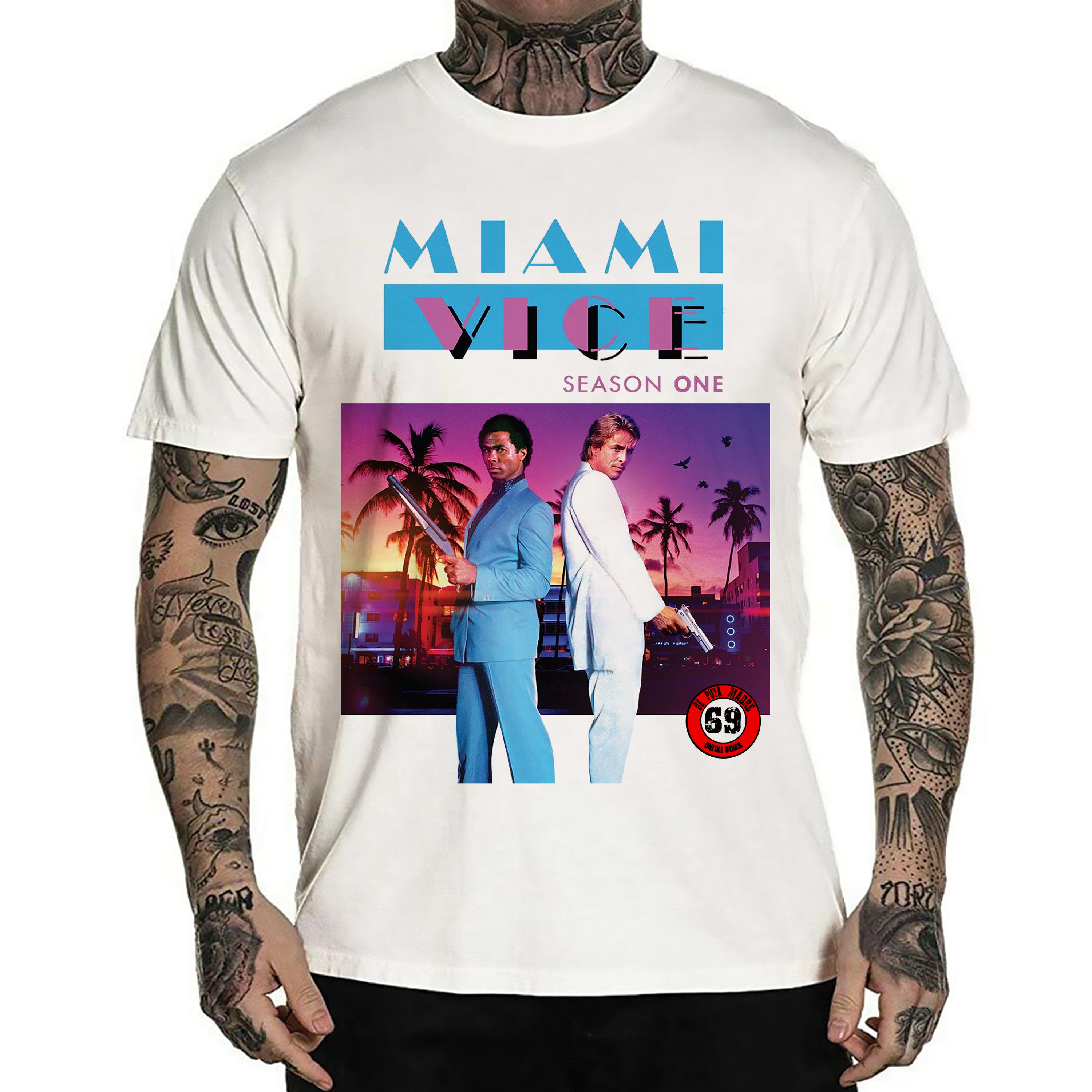 Men's white t-shirt featuring Miami Vice design with vibrant colors and handmade prints, showcasing a trendy and stylish look.