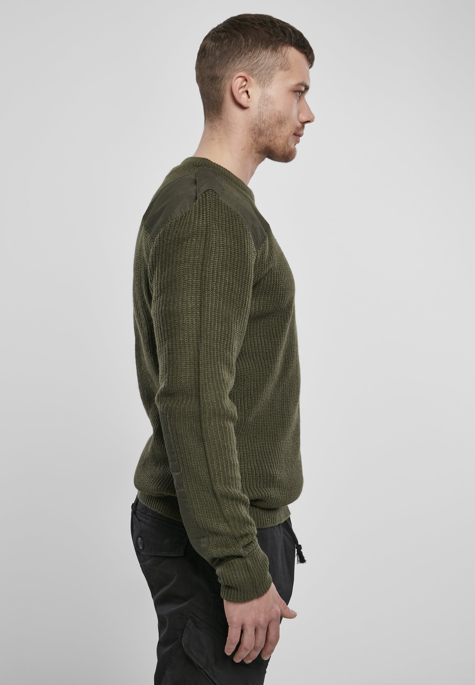 A durable Military Sweater featuring reinforced elbows and shoulders, epaulettes, and a patch chest pocket in muted colors.