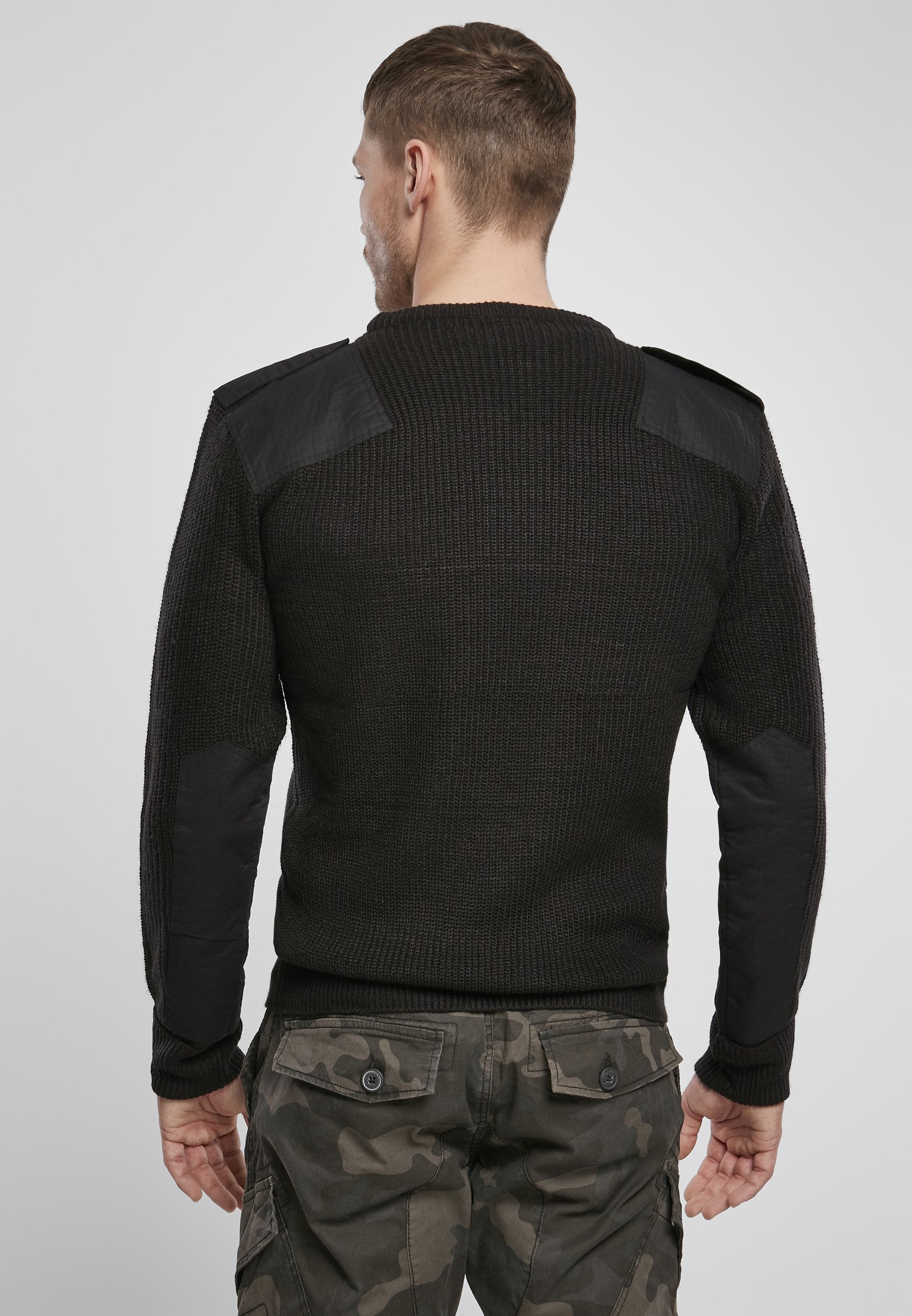 A durable Military Sweater featuring reinforced elbows and shoulders, epaulettes, and a patch chest pocket in muted colors.