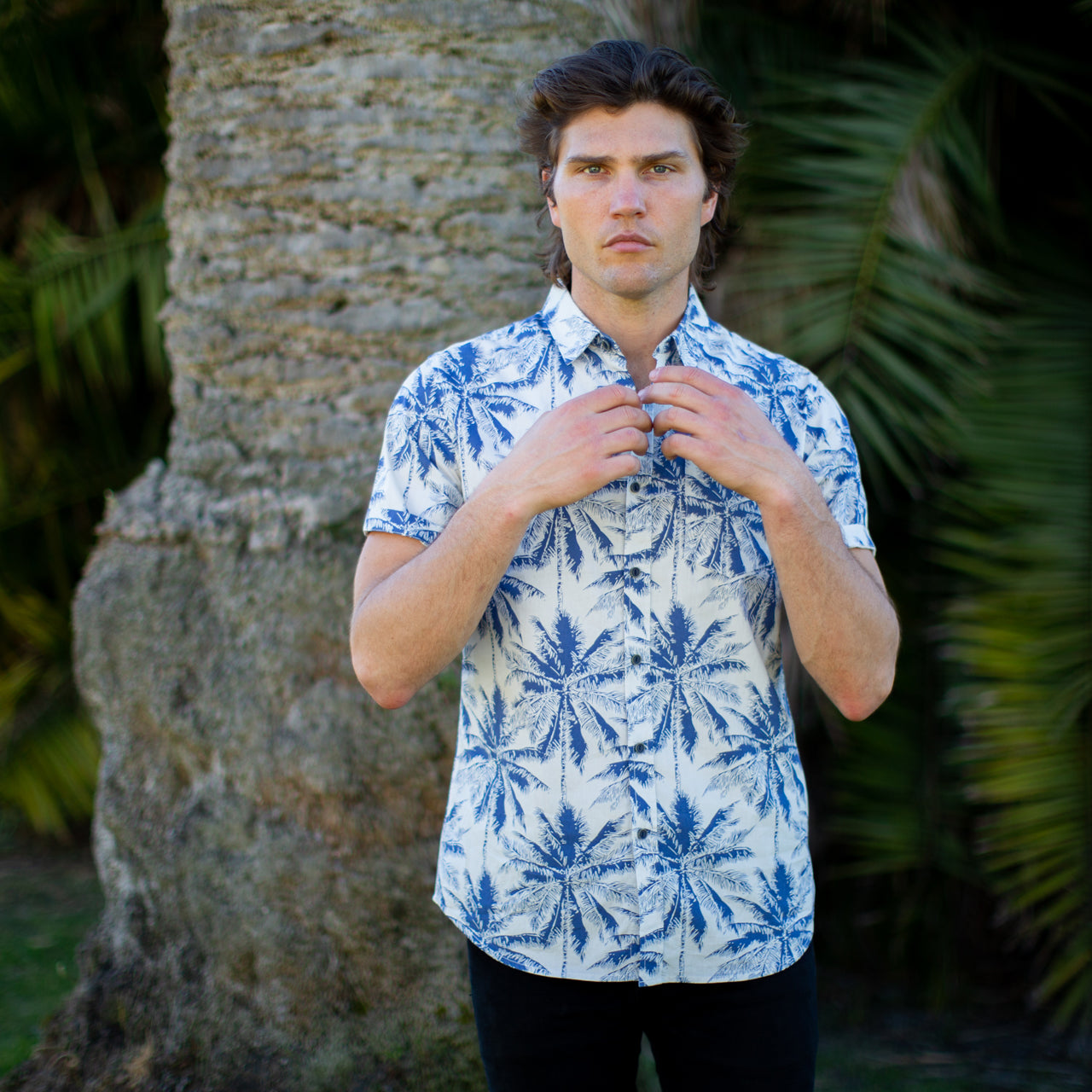 Mitchell Printed Shirt featuring a navy background with palm tree prints, perfect for summer casual wear.