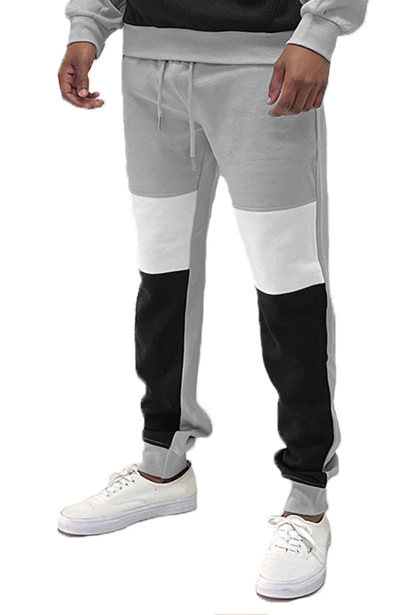 A pair of stylish Mono Sweat Pants featuring an elastic waist and ribbed ankle cuffs, made from a soft cotton-polyester blend.