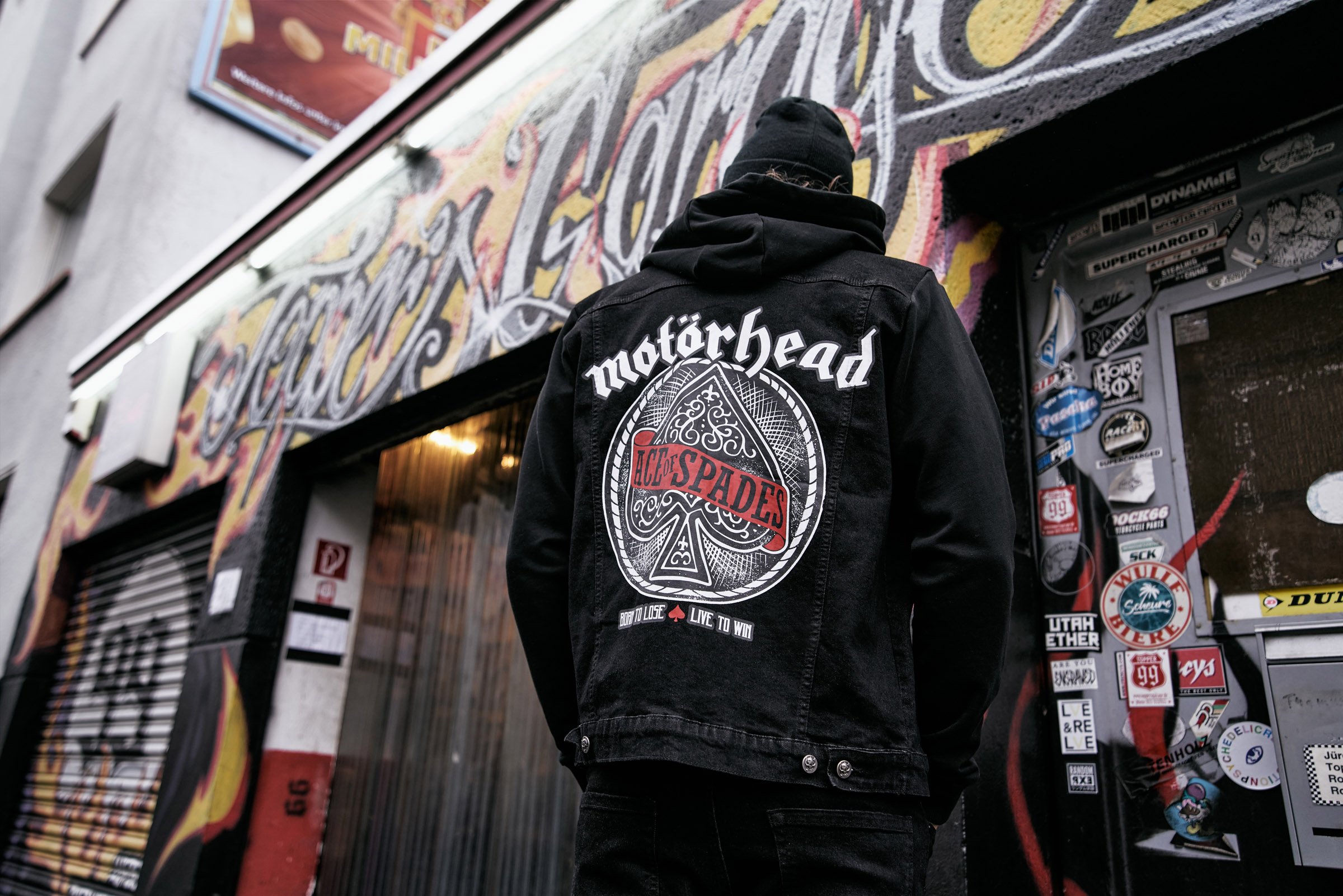 Motörhead Cradock Denim Jacket featuring large back print, detachable hood, and multiple pockets, showcasing a classic rock style.