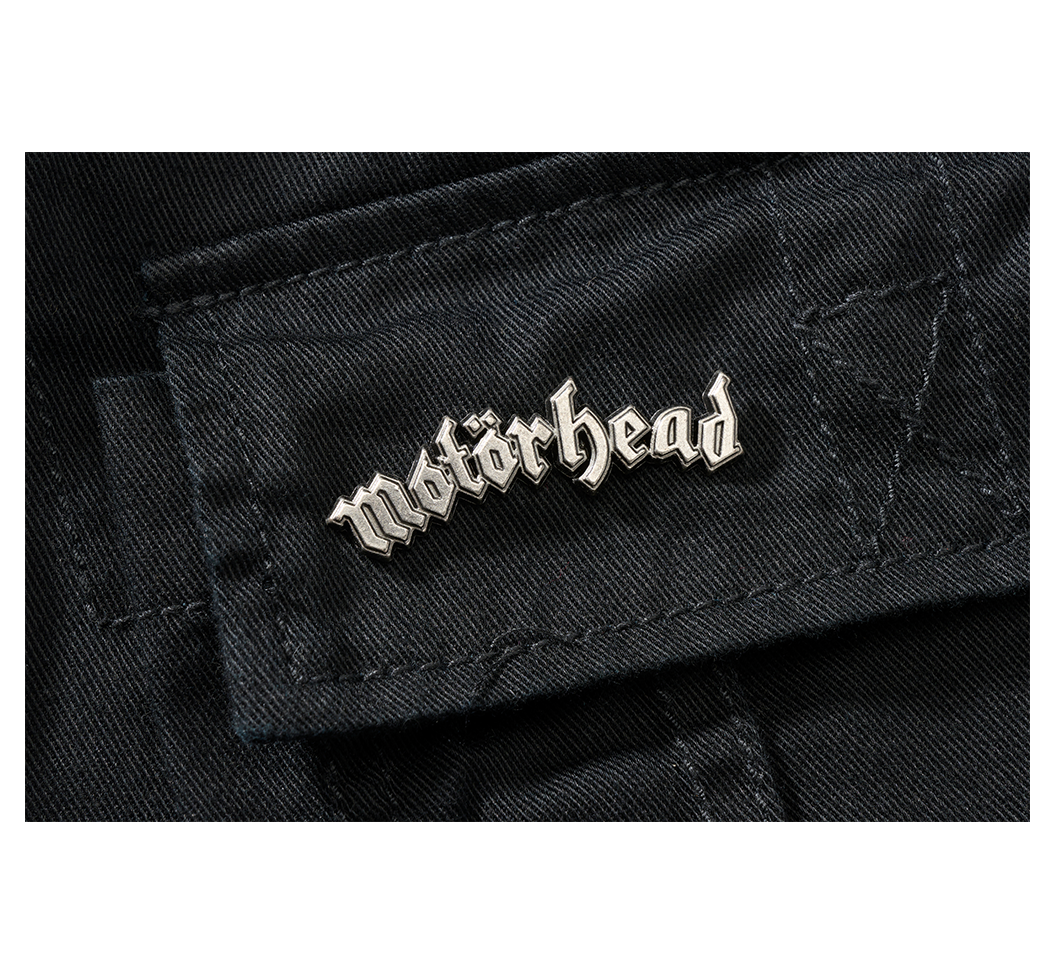 Motörhead pin on black fabric.