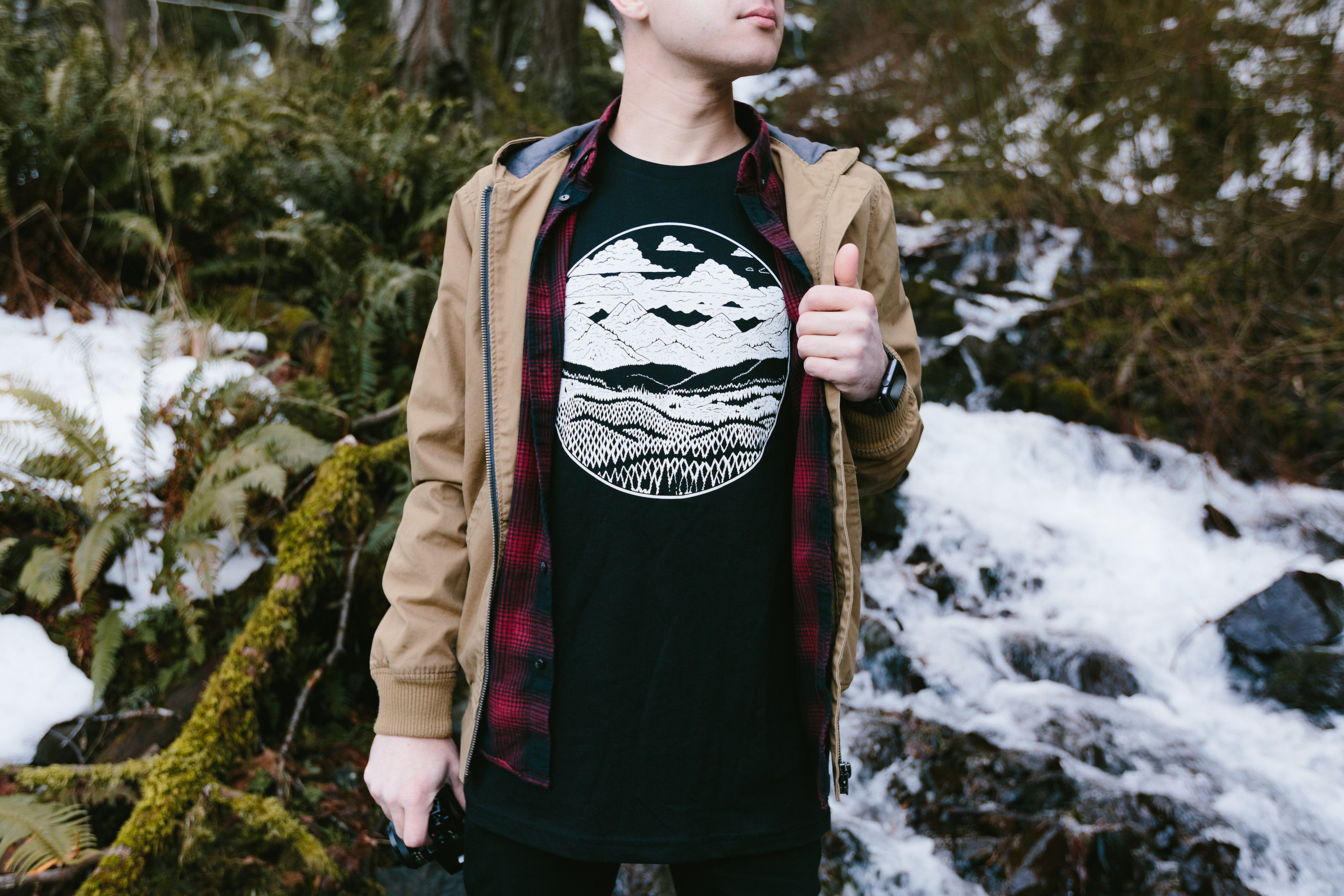 Black Mountain Range Tee featuring a white screen printed mountain design, made from 100% ringspun cotton, ideal for outdoor enthusiasts.