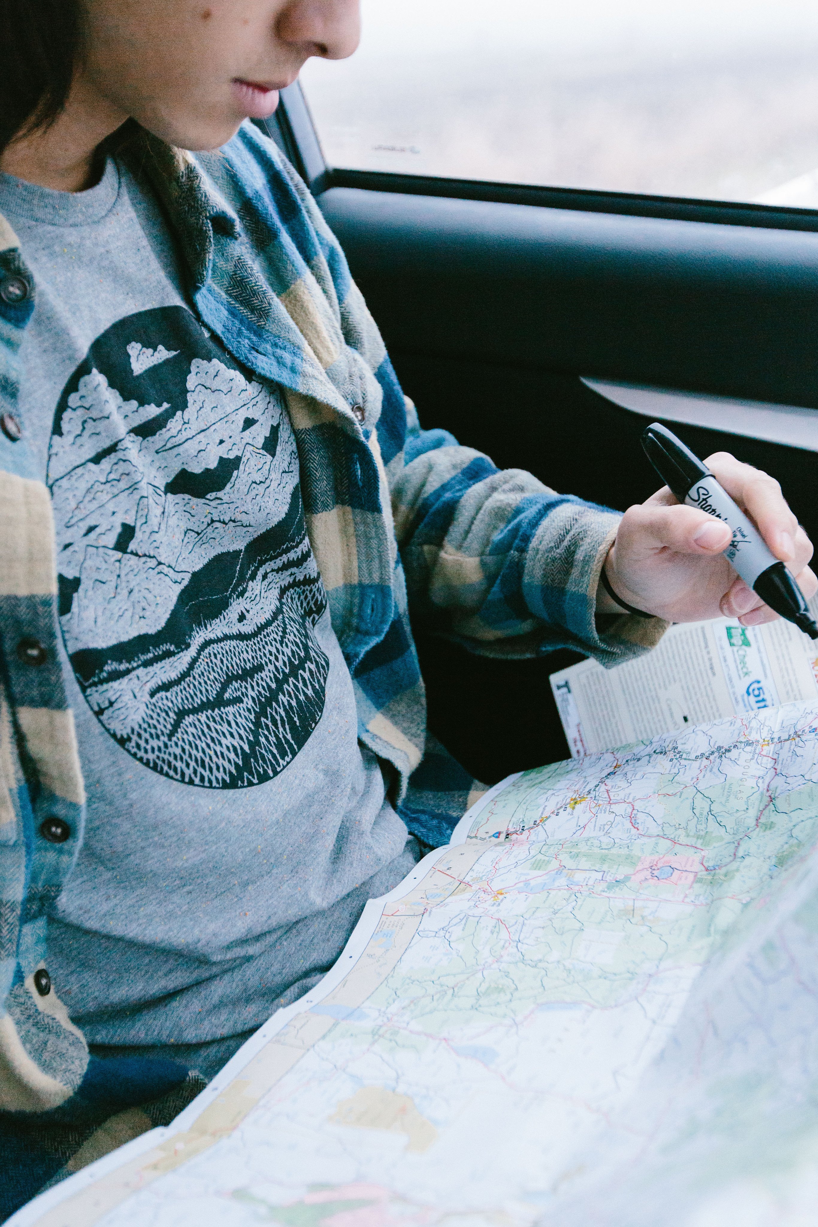 Gray speckled Mountain Range Tee featuring a unique mountain design printed in black water-based ink.