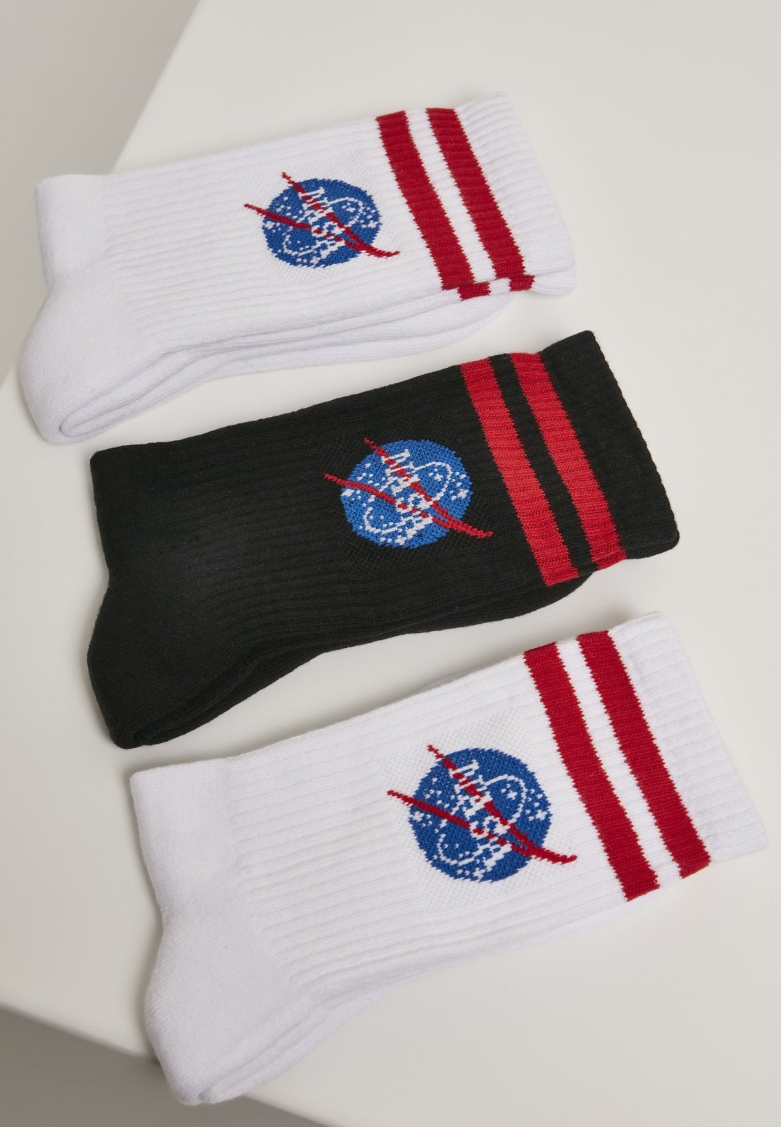 A pack of three NASA insignia socks featuring the iconic logo, showcasing their vibrant colors and soft fabric.